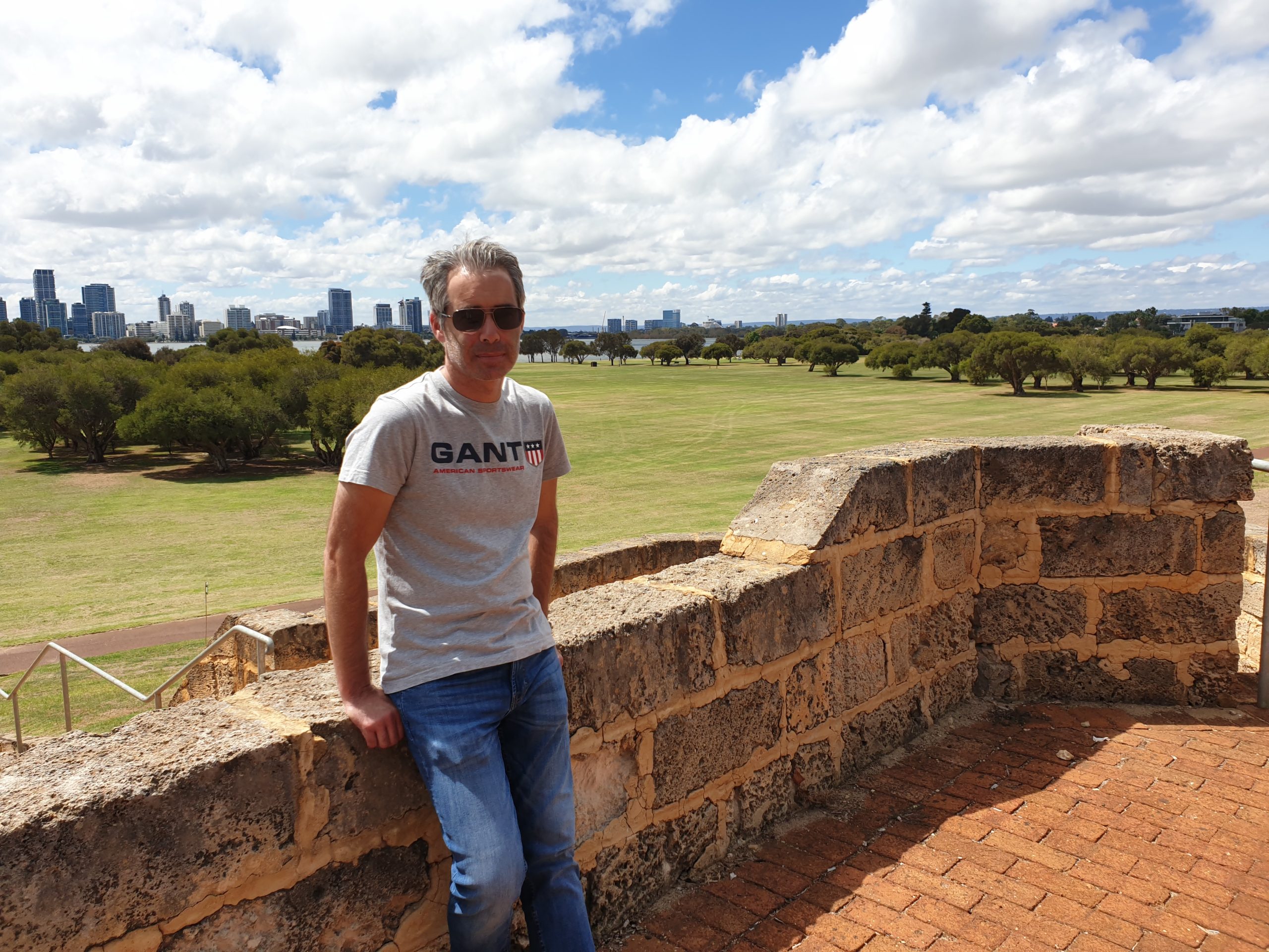 Side on looking at camera, park background